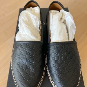 Gucci Black Leather Loafers with Embossed Design